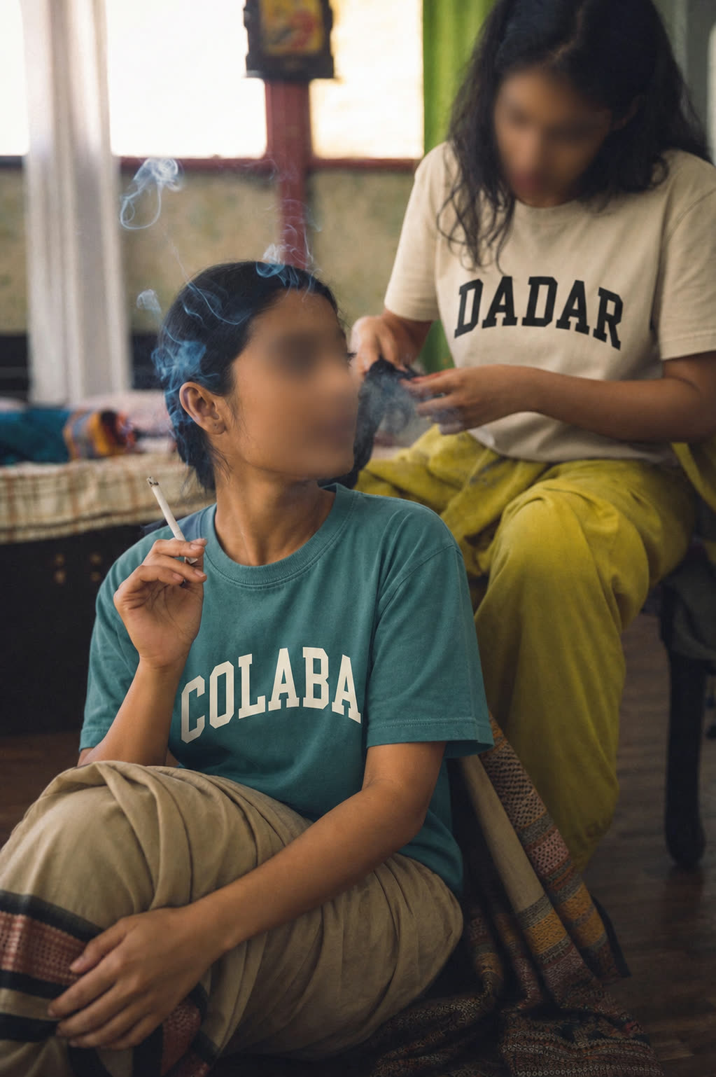 Two people wearing the Colaba and Dadar tees