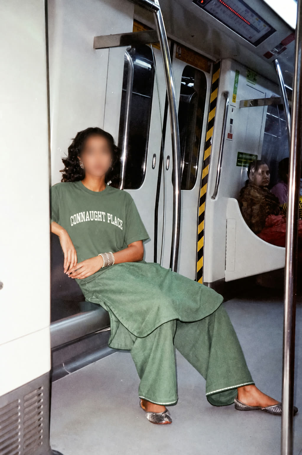 A metro commuter in the Connaught Place tee