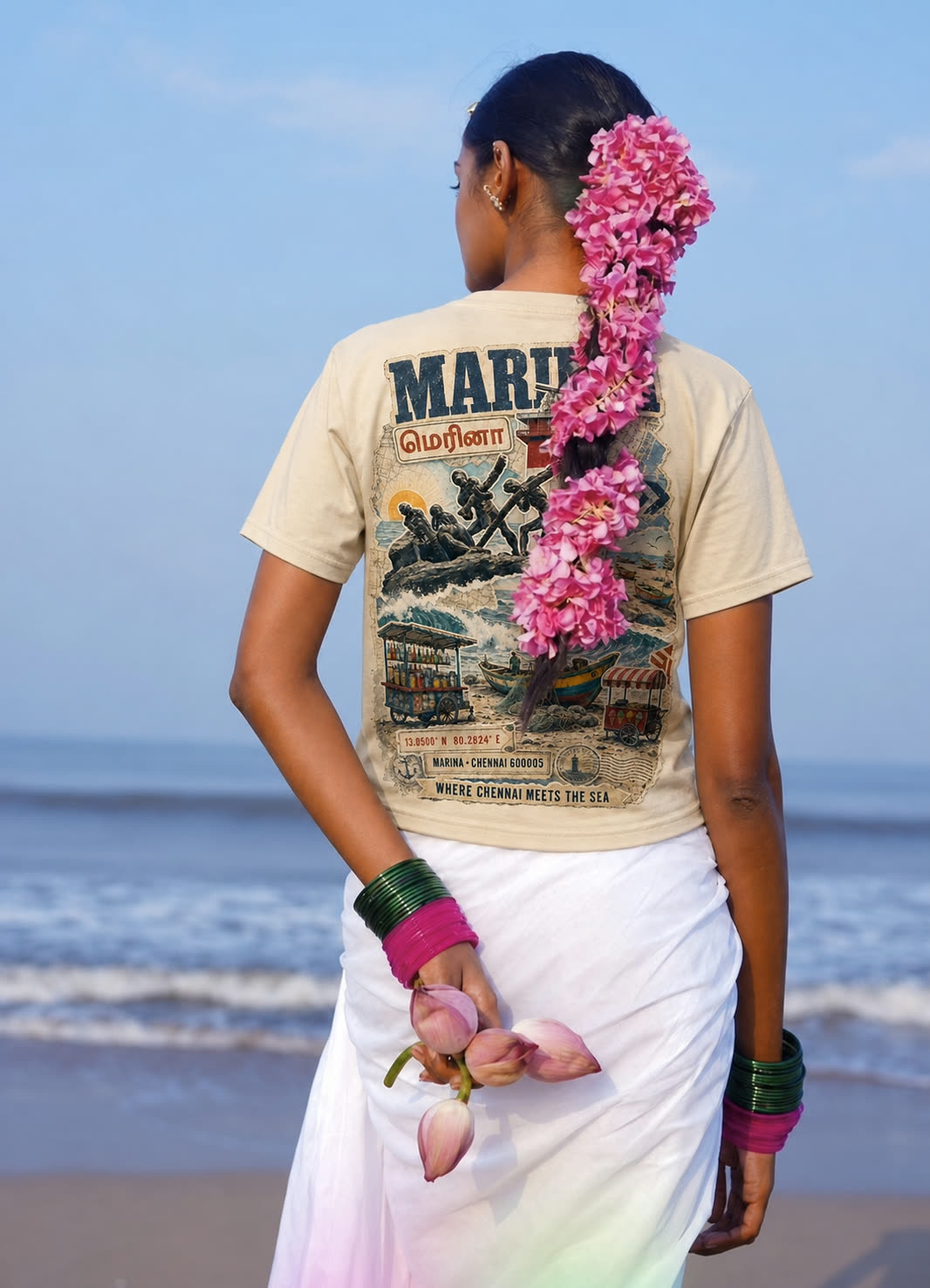 A woman on Marina beach wearing the Marina Chennai tee