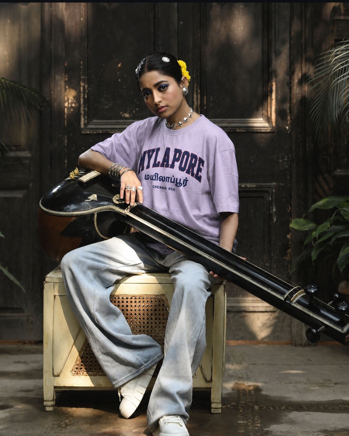 Street musician in Mylapore wearing the APSHABD Mylapore tee