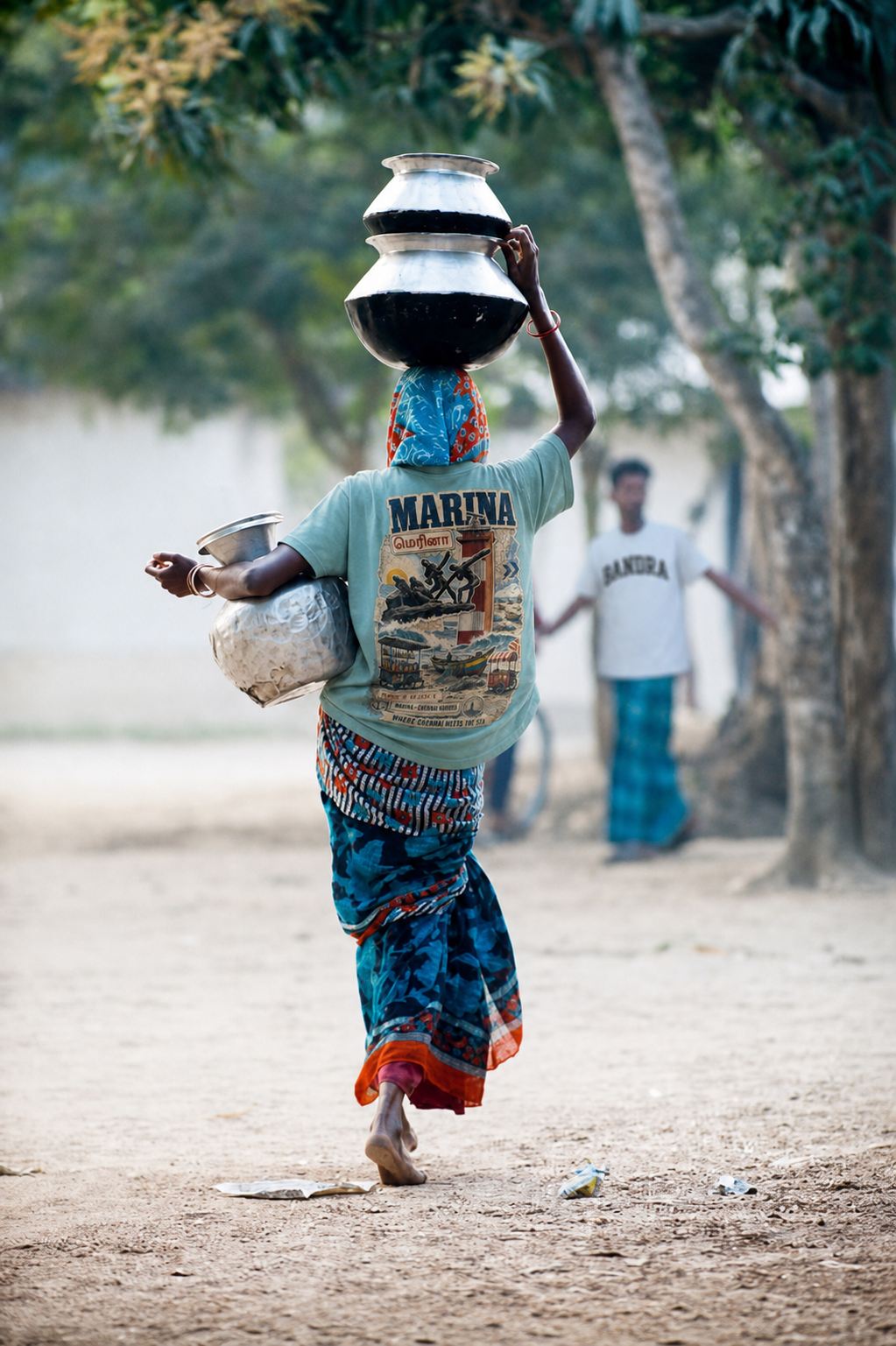 Water carrier on Marina beach wearing the APSHABD Marina tee