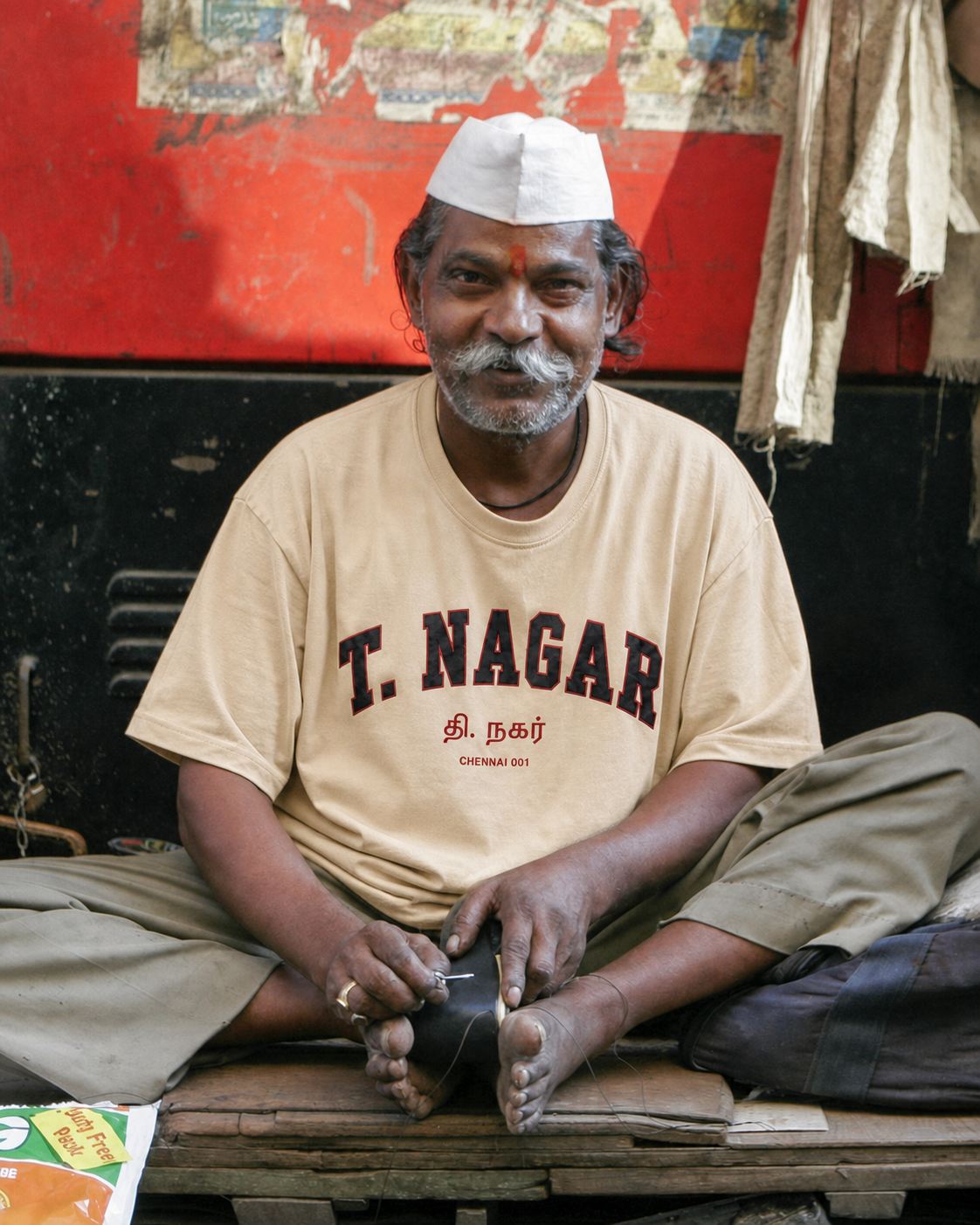 Craftsman at work in T. Nagar wearing the APSHABD T. Nagar tee